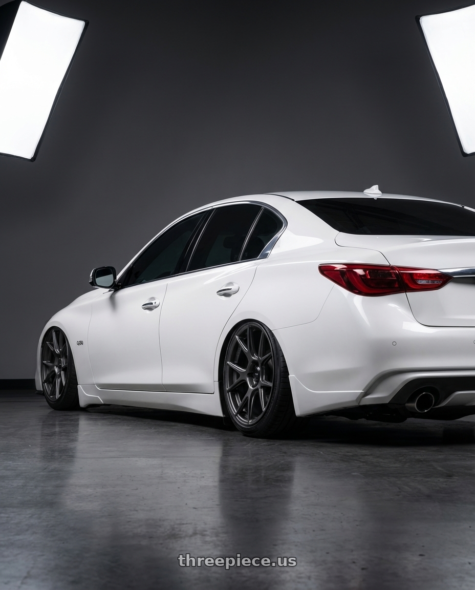 2020 Infiniti Q50 with Konig Ampliform 5x114.3 20x9.5+25 Dark Metallic Graphite wheels rear three quarter view slight stretch tires