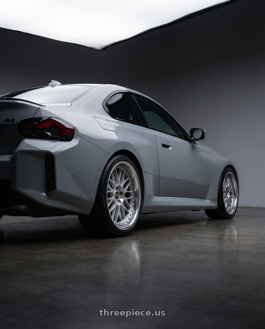 2025 bmw m2  with Work Vs-Xx 5x100 18x7+13 A Disk Light Grey Silver wheels rear three quarter view square tires