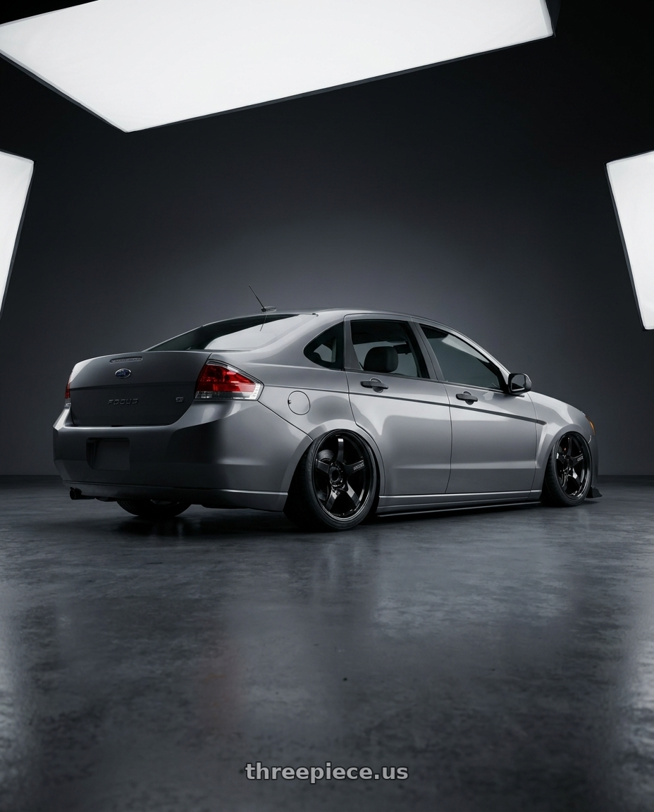 2008 Ford Focus with Gram Lights 57CR 5x112 19x10.5+22 Glossy Black wheels rear three quarter view slight stretch tires