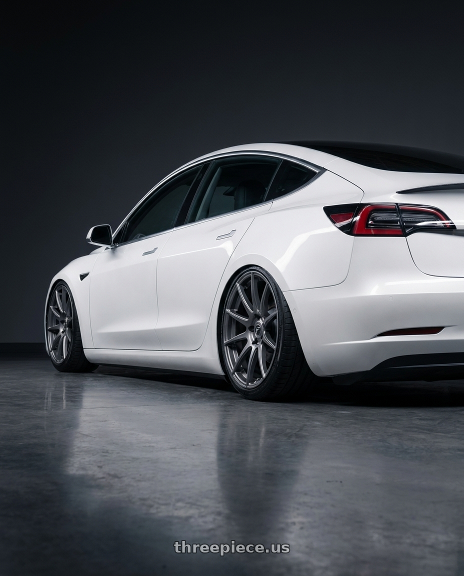 2023 Tesla Model 3 with Forgestar CF10 5x114.3 19x10 +42 Gloss Anthracite wheels rear three quarter view slight stretch tires