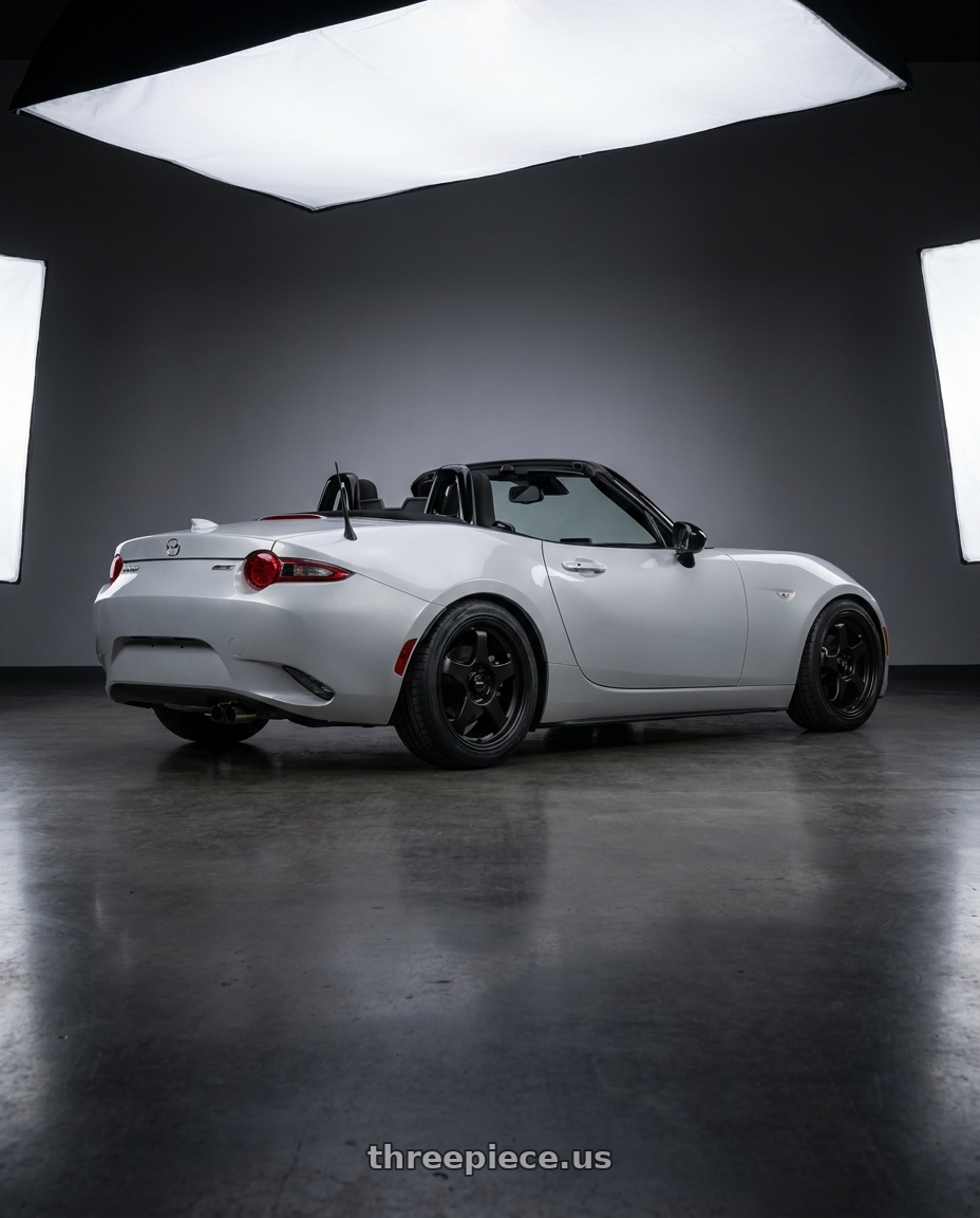 2015 Mazda Mx5 with Vors SP1 4x100/4x114.3 16x7  +38 All Matte Black wheels rear three quarter view square tires