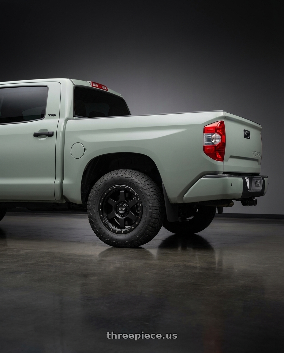 2018 Toyota Tundra with KMC KM101 TEMPO 5X150 20X9 +18 SATIN BLACK wheels rear three quarter view meaty tires