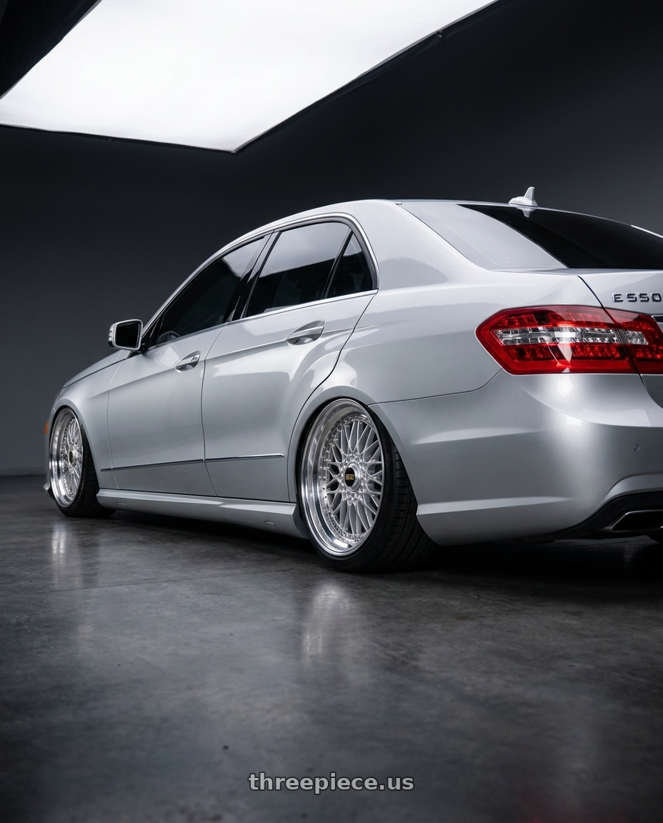 2012 Mercedes E550 with BBS Super 5x112 19x10 +40 Diamond Silver wheels rear three quarter view extreme stretch tires