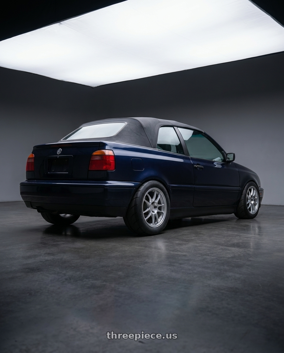 1998 vw cabrio blue with Enkei PF01 4x100 15x7+35 Silver wheels rear three quarter view excessive tires