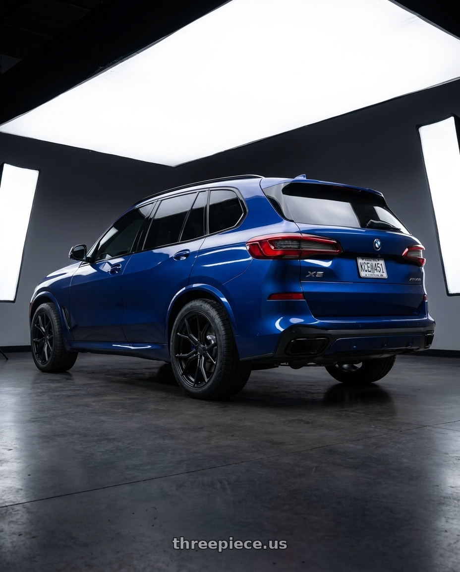 2023 bmw x5 blue with Aodhan AFF1 5x114.3 20x10.5+45 Matte Black wheels rear three quarter view meaty tires