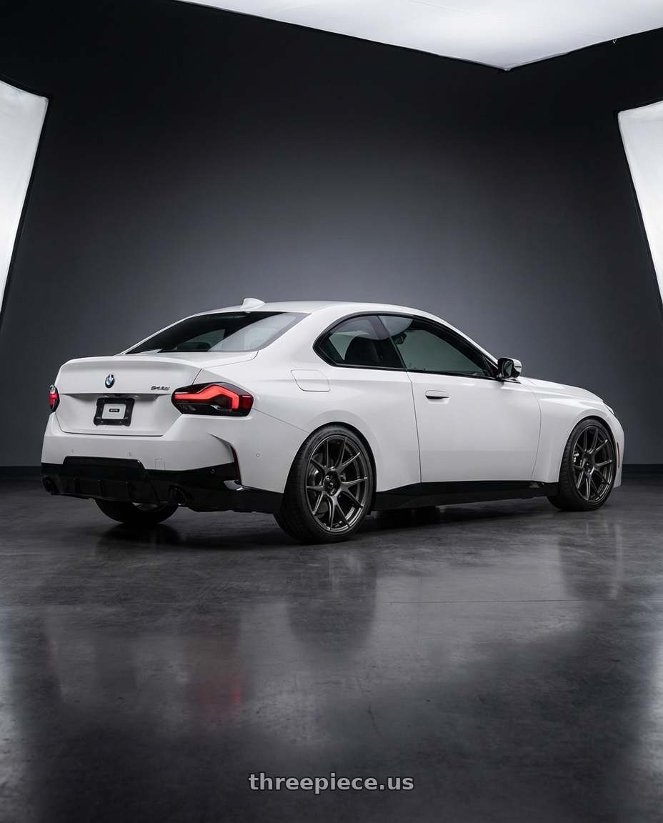 2024 BMW 2 Series G42 with Konig Ampliform 5x112 19x8.5+32 Dark Metallic Graphite wheels rear three quarter view square tires