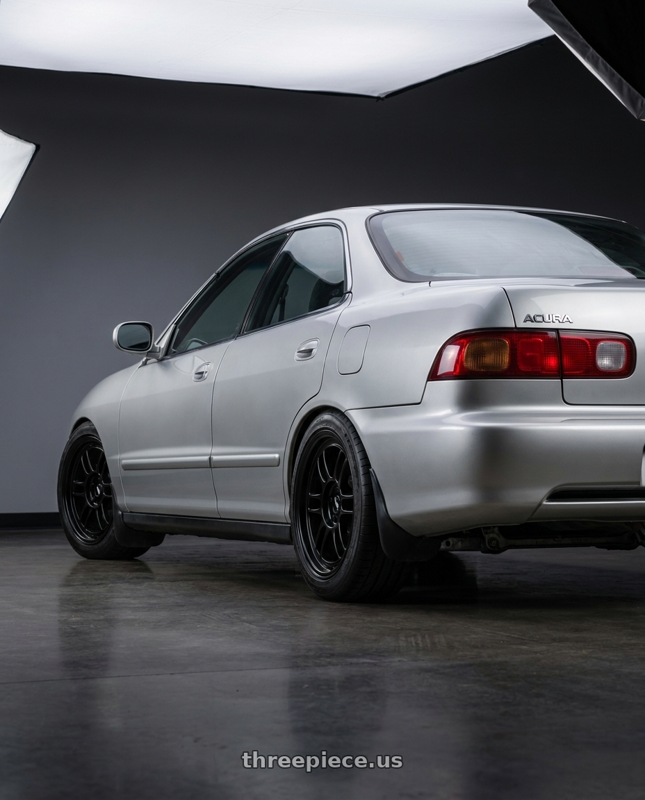 1998 Acura Integra with Enkei RPF1 4x100 16x7+43 Black wheels rear three quarter view square tires
