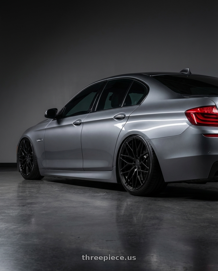 2016 BMW 5 Series F10 with Avant Garde Wheels M520R 5X120 20x9 +38 Gloss Black wheels rear three quarter view slight stretch tires