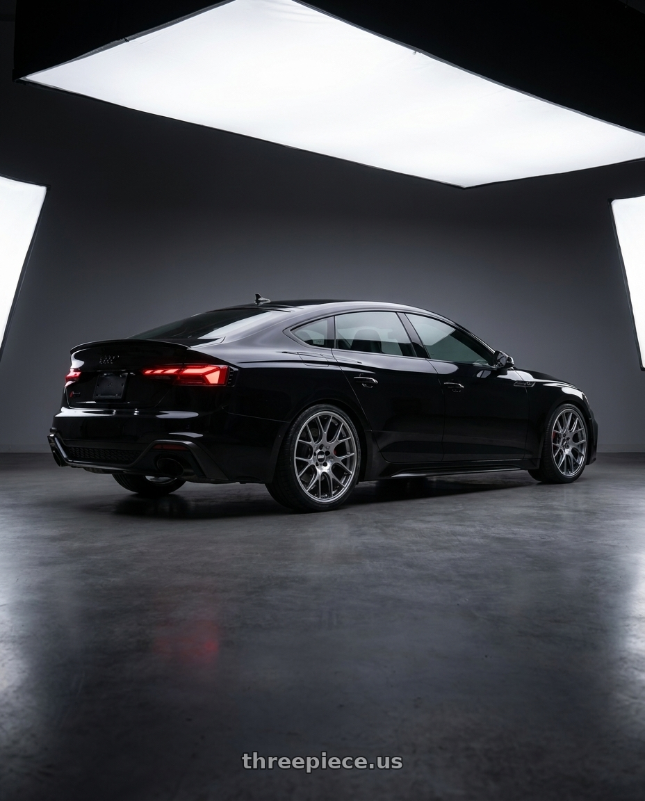 2024 Audi RS5 Sportback Comp black exterior with BBS CH-R 5x112 20x10.5 +25 Satin Titanium Polished Rim Protector wheels rear three quarter view slight stretch tires