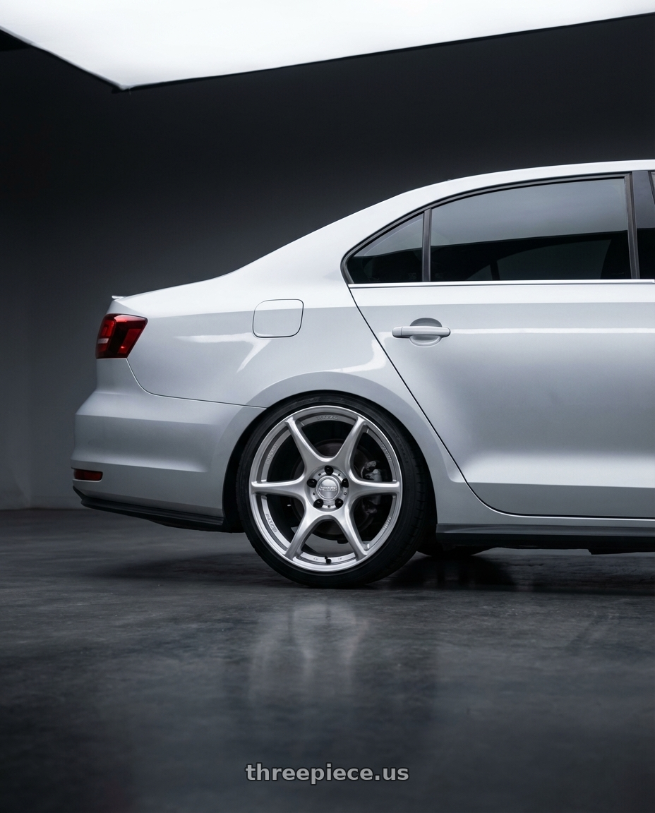 2016 Volkswagen Jetta GLI MK6 with Kansei K11S Tandem 5X112 18x8.5 35 Hyper Silver wheels rear three quarter view square tires