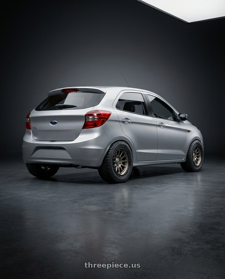 2017 Ford Figo TDCi Ingot Silver with fifteen52 RANGE HD 5x127 17x8.5 +0 MAGNESIUM GREY (SATIN BRONZE/SATIN BLACK RING) wheels rear three quarter view meaty tires