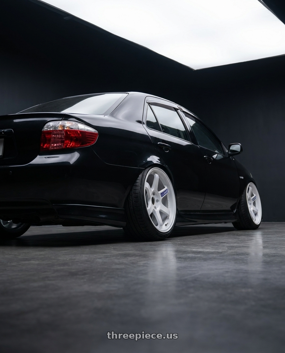 2007 Toyota Vios black  with Volk Racing TE37 Gravel 5x114.3 15x7.0+35 White wheels rear three quarter view extreme stretch tires