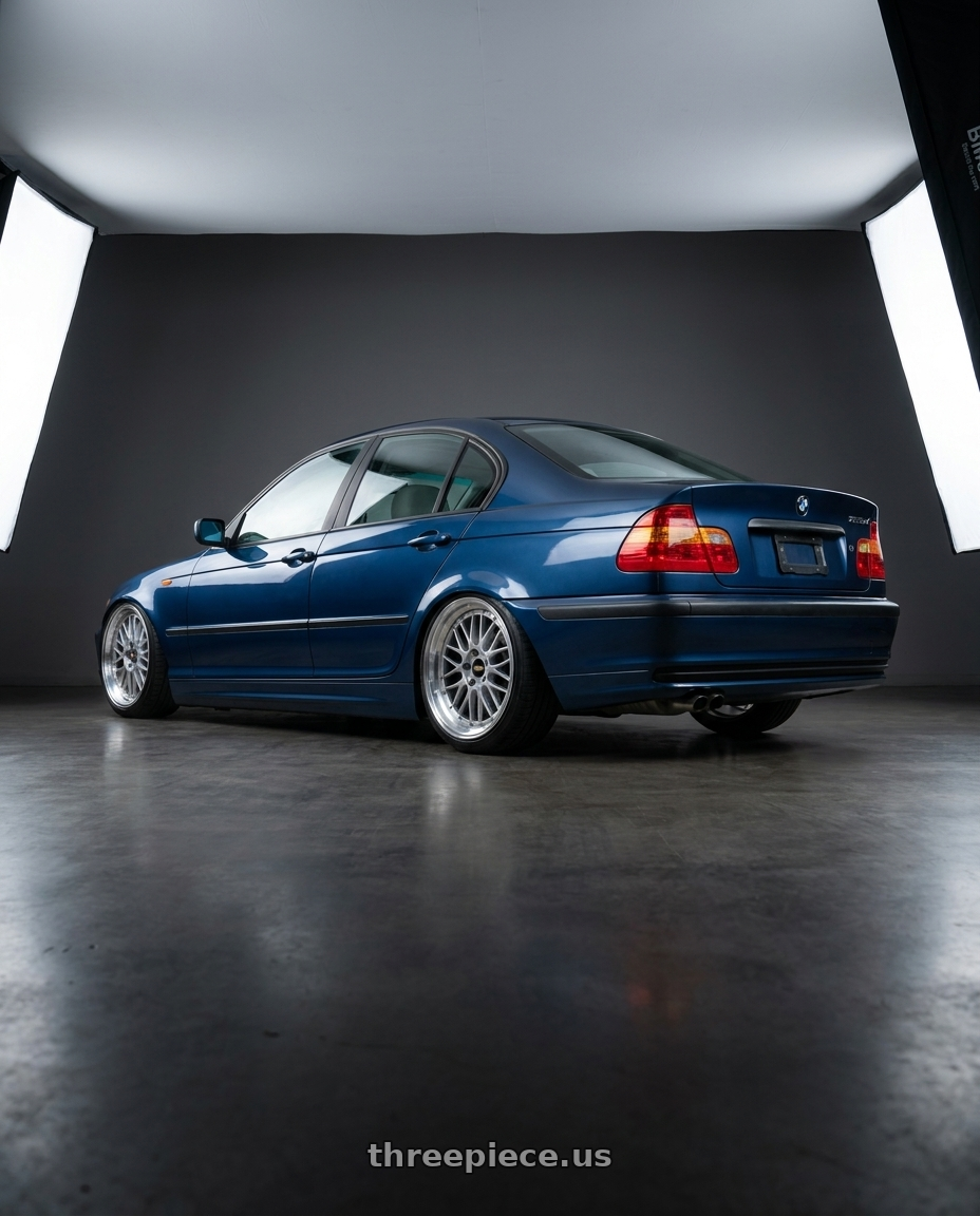 2003 Bmw 325xi sedan blue with BBS LM 5x120 17x8.0+40 Diamond Silver wheels rear three quarter view slight stretch tires