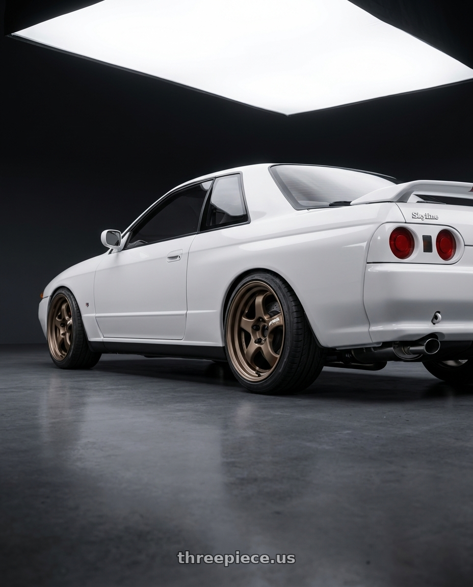 1990 Nissan skyline with Work Meister S1R 4x100 16x6+45 A Disk Ashdot Titanium wheels rear three quarter view slight stretch tires