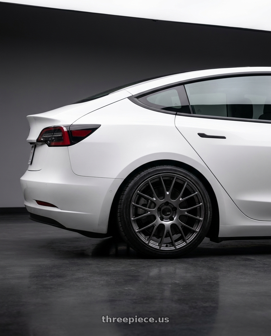 2023 Tesla Model 3 with Ssr Gtv04 5x114.3 19×8.5x8.5+45  METALLIC GRAY wheels rear three quarter view square tires