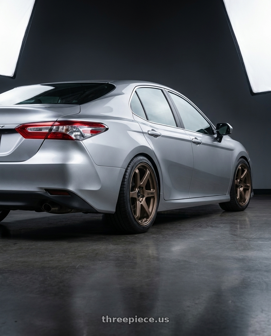 2021 Toyota Camry Hybrid LE with Enkei T6R 5x114.3 18x8.5+38 Matte Bronze wheels rear three quarter view square tires