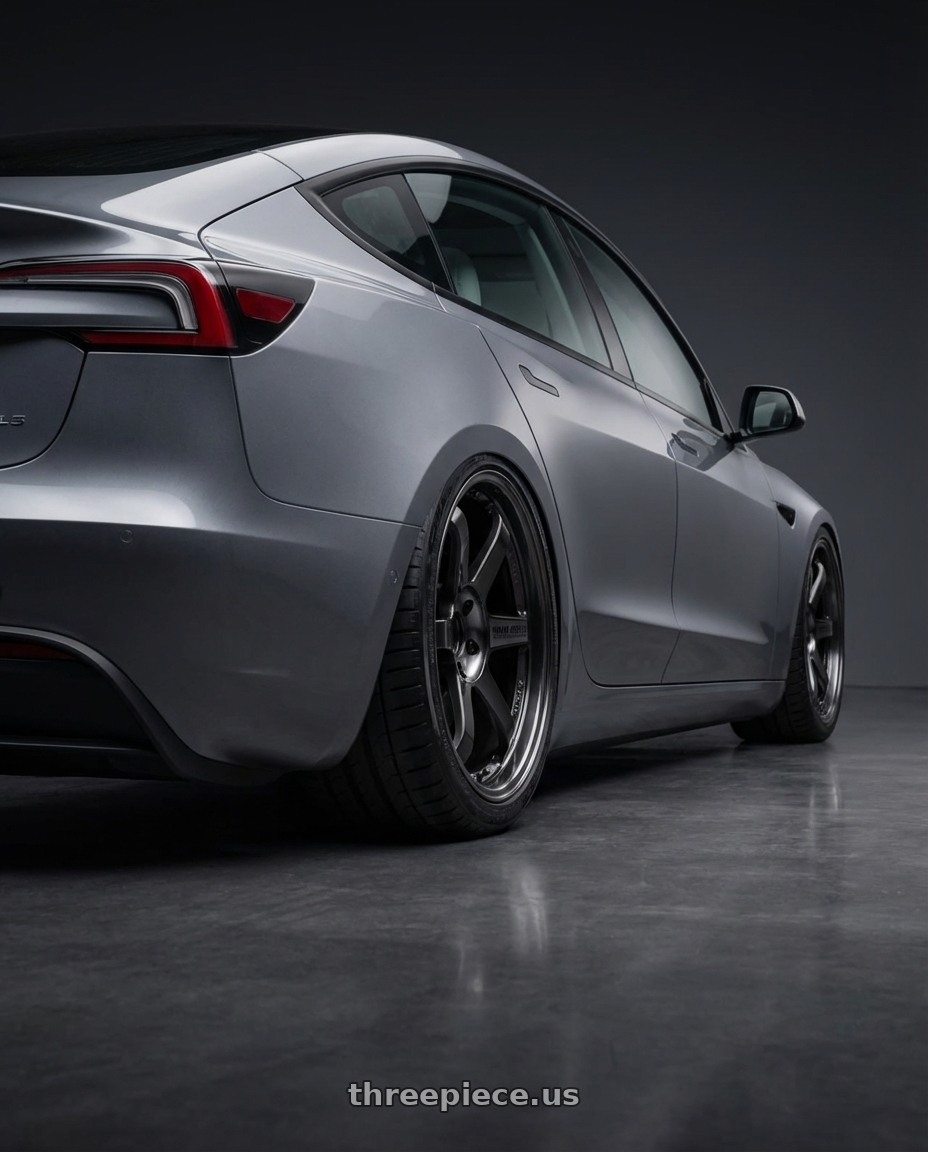 2025 Tesla model 3, grey with Volk Racing TE37SL 5x114.3 19x10.5+12 Pressed Double Black wheels rear three quarter view square tires