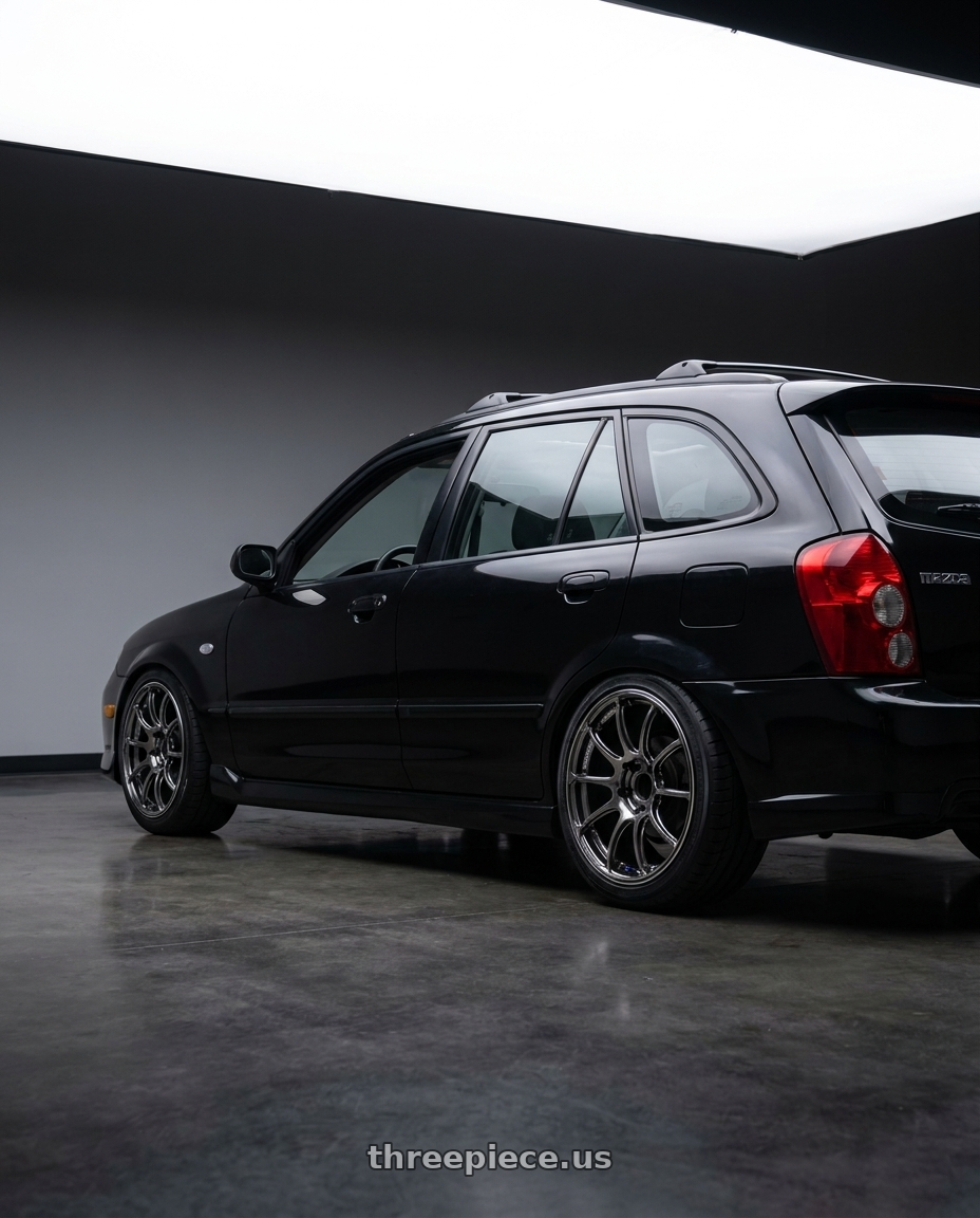 2002 Mazda Protege5 with Advan Racing RZII 5x114.3 16x7.0 +45 RACING HYPER BLACK & RING wheels rear three quarter view square tires