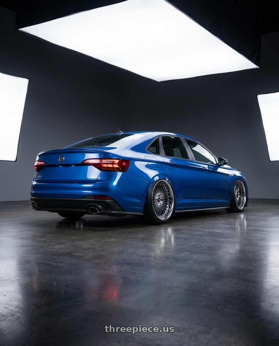 2024 Volkswagen jetta gli blue with Work Emitz Black Polish 5x100 19x9.0 +45 wheels rear three quarter view slight stretch tires