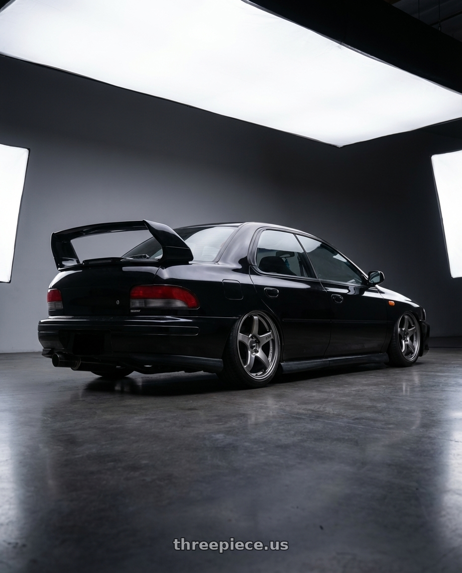 1998 Subaru Impreza GC8 with Enkei PF05 5x100 17x9+40 Dark Silver wheels rear three quarter view slight stretch tires