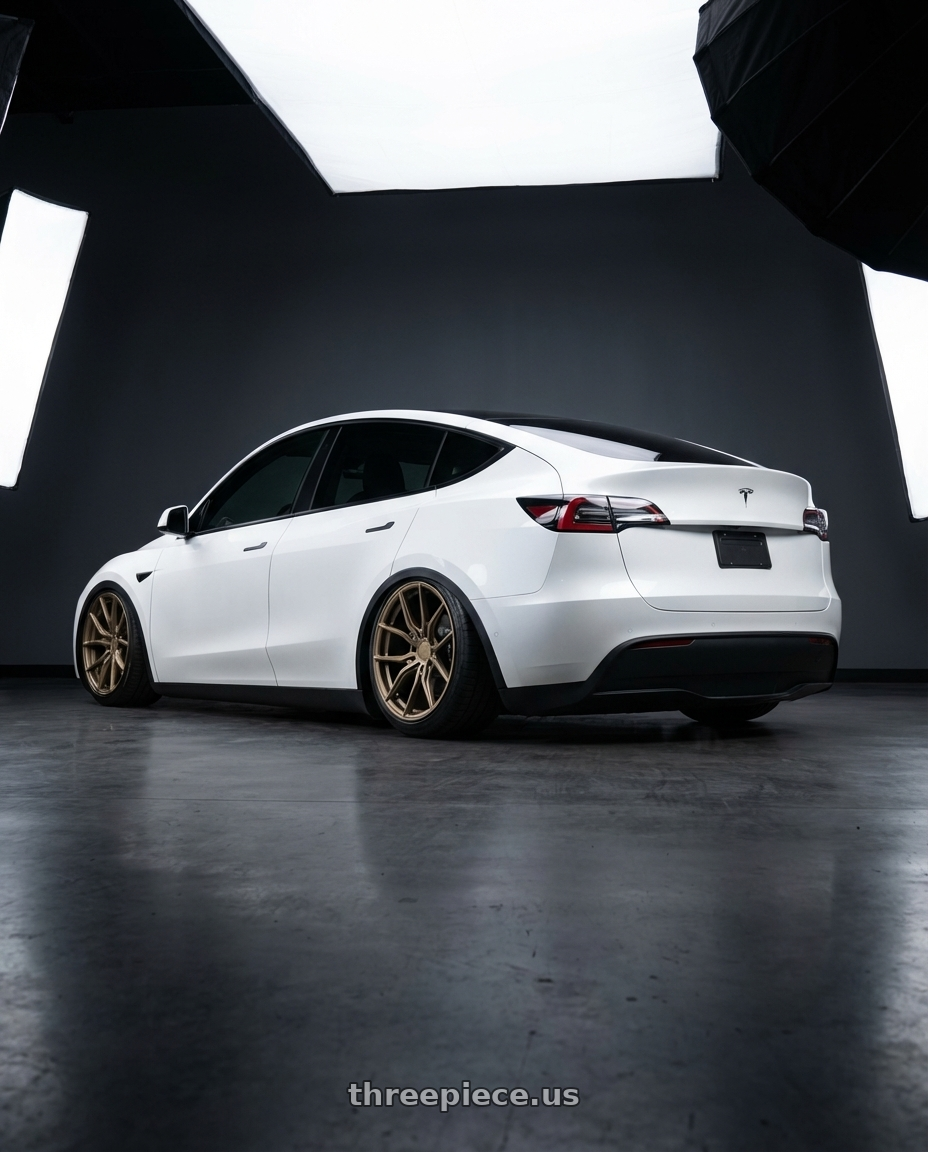 2024 Tesla Model Y with Aodhan AFF1 5x114.3 20x9+32 Matte Bronze wheels rear three quarter view slight stretch tires