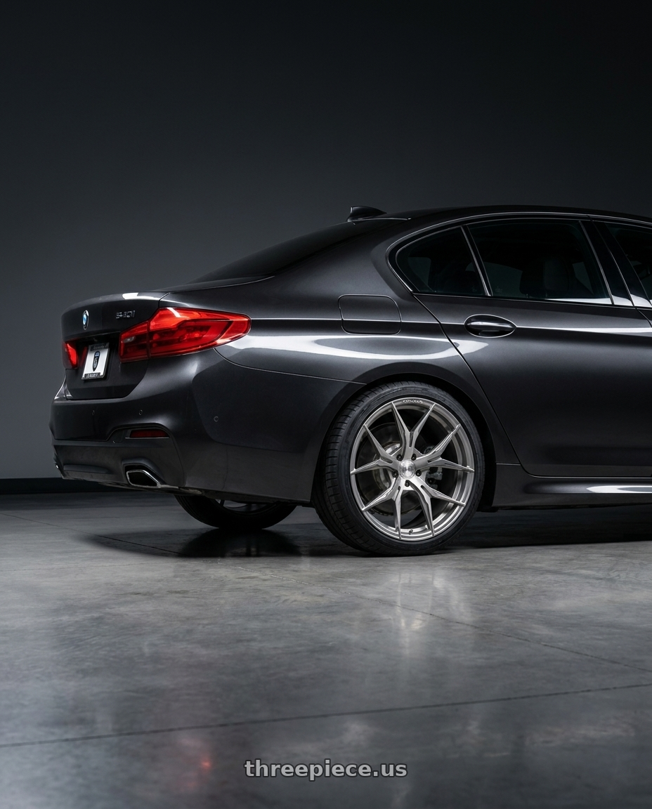 2021 bmw 540 with Rohana RFX5 5x112 19x9.5+42 Brushed Titanium wheels rear three quarter view square tires