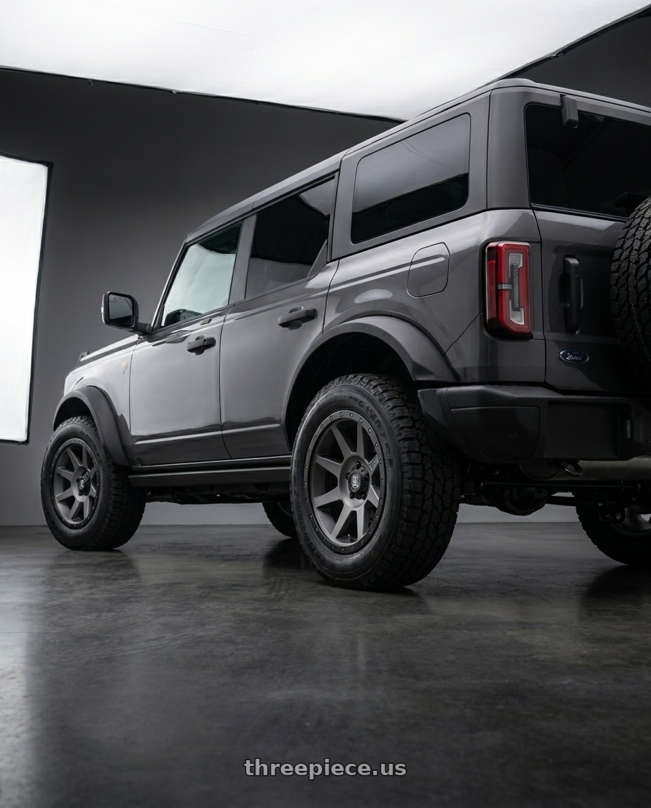 2023 Ford Bronco Badlands with Icon Alloys REBOUND 6x139.7 17X8.5+25 TITANIUM wheels rear three quarter view square tires