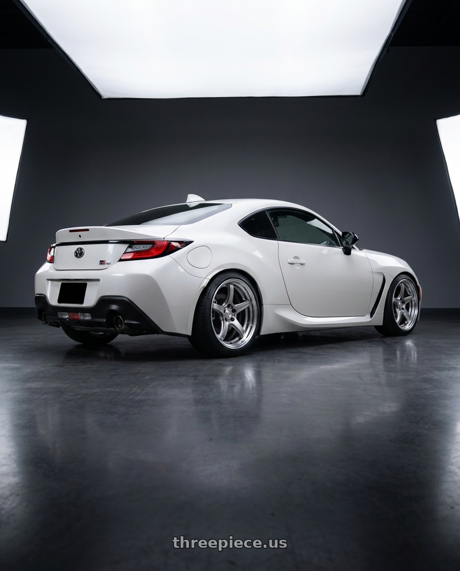 2023 Toyota GR86 with Work T5R 2P 5x100 18x8 +38 GT SILVER wheels rear three quarter view square tires