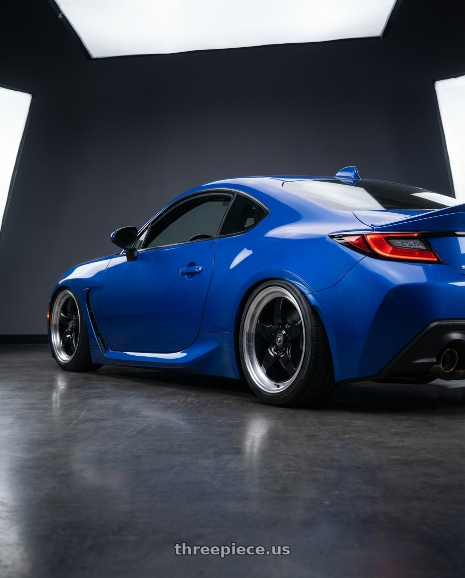 2024 Subaru BRZ with Forgestar D5 Drag 5x114.3 18x10 +42 Gloss Black Machined wheels rear three quarter view slight stretch tires