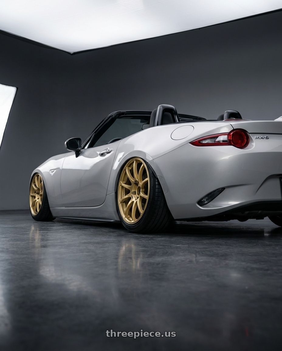 2021 Mazda MX-5 Miata ND with Advan RCIII 5x114.3 17x7+45 Gold wheels rear three quarter view slight stretch tires