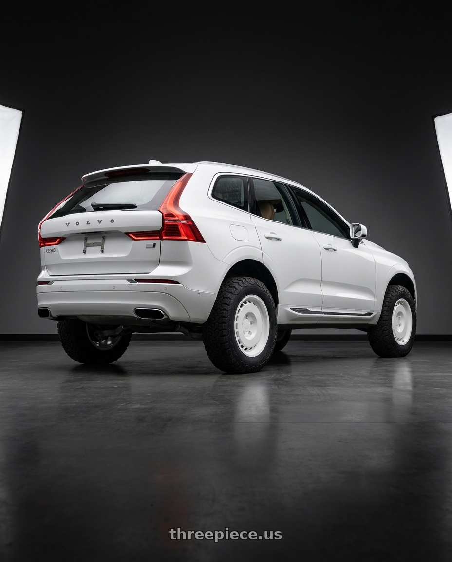 2020 Volvo XC60 with Fifteen52 Evolution MX 5x108 17x8 +38 Classic White wheels rear three quarter view meaty tires