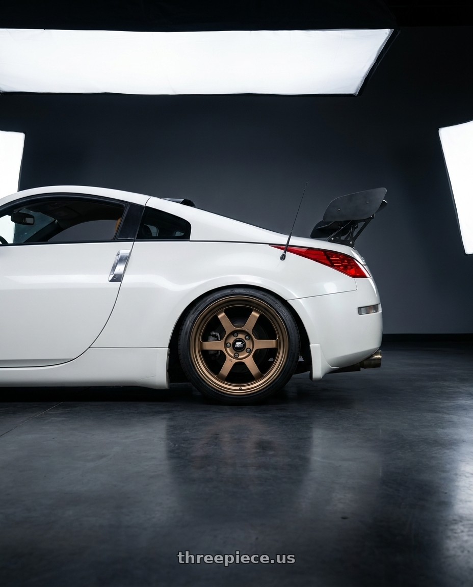2007 nissan 350z with MST Wheels Time Attack 5x100 15x7.0 +20 Matte Bronze wheels rear three quarter view slight stretch tires