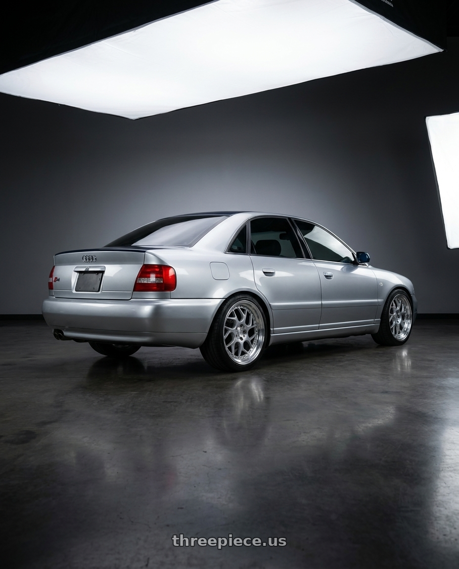 2001 Audi S4 with Aodhan DS01 5x114.3 18x9.5+22 Silver Machined Lip w/Chrome Rivets wheels rear three quarter view square tires