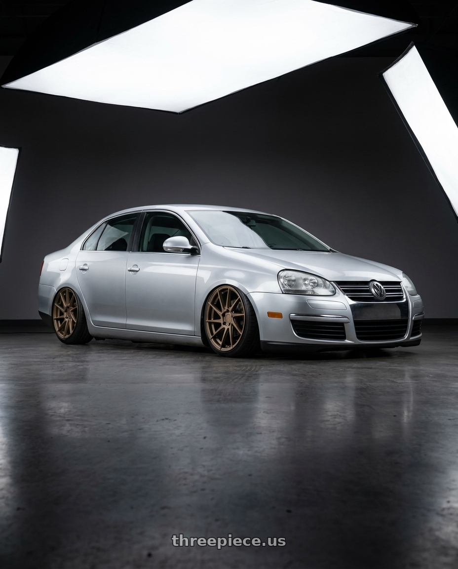 2009 Volkswagen Jetta GLI MK5 with Aodhan AH09 5x112 18x9.5 +35 Matte Bronze wheels