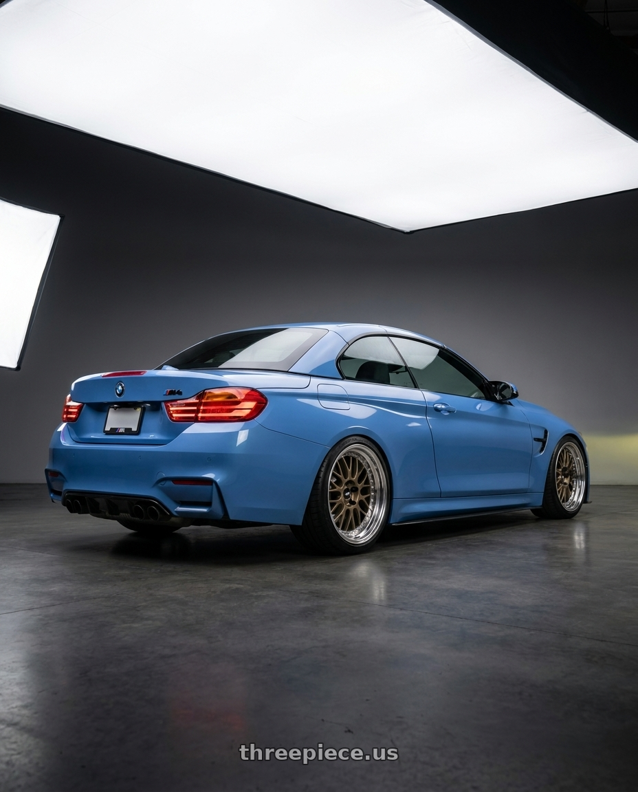 2015 bmw m4 convertible yas marina blue with Work Meister M1 3p 5x120 18x9.5+30 A Disk Titanium Gold wheels rear three quarter view square tires
