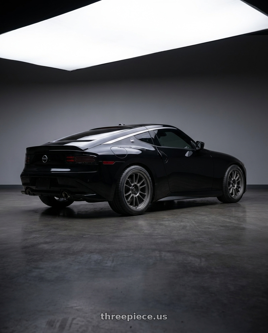2024 Nissan Z black with Konig Hypergram 5X114.3 19x9.5+25 Matte Grey Flow Formed wheels rear three quarter view square tires