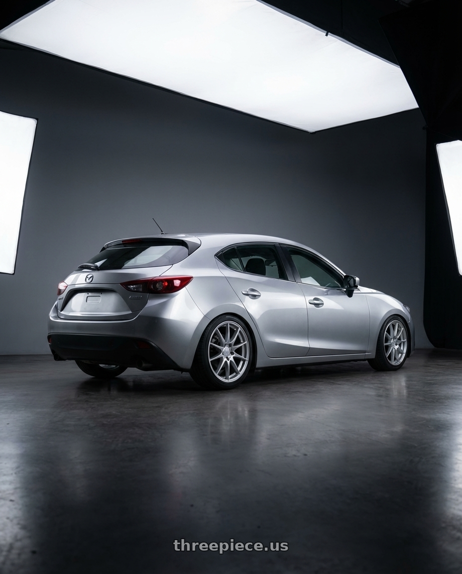 2013 mazda3 skyactiv with Enkei EKM3 5x114.3 18x7.5+45 Hyper Silver wheels rear three quarter view square tires