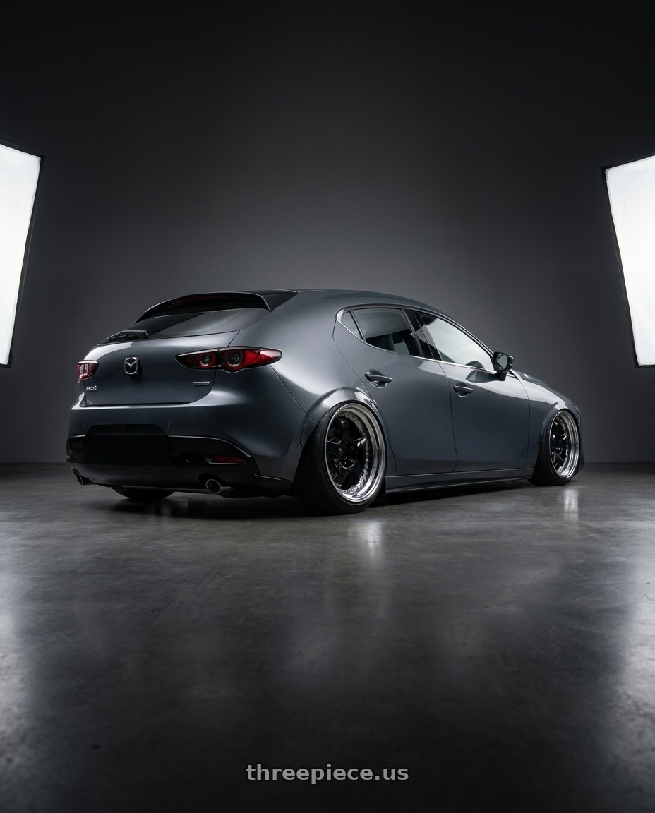 2020 Mazda 3 hb with Work Meister S1 3P 5x100 18x8+48 A Disk Black wheels rear three quarter view slight stretch tires