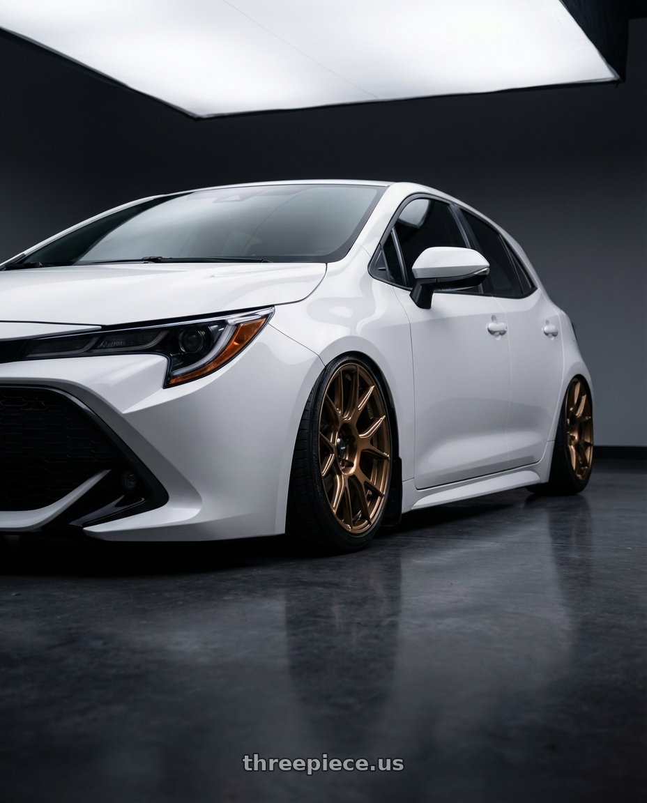 2023 Toyota Corolla Hatchback with Konig Ampliform 5x114.3 18x8.5+35 Gloss Bronze wheels