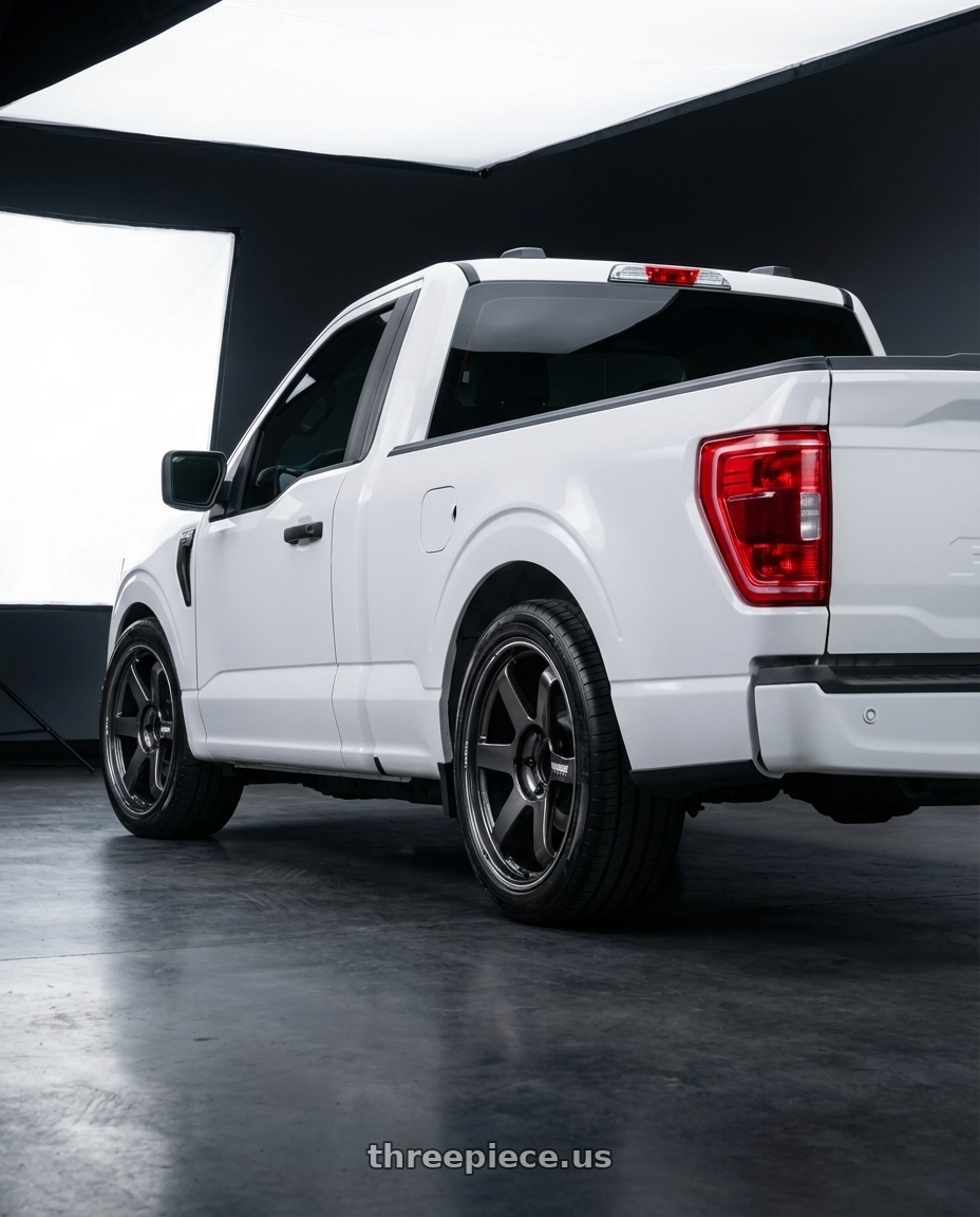 2024 Ford F150 with Volk Racing TE37 Ultra Large PCD 6x139.7 20x8.5+45 Diamond Dark Gunmetal wheels rear three quarter view square tires