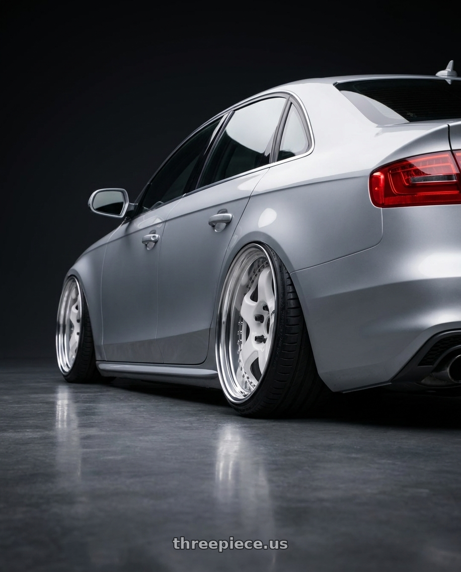 2016 Audi A4 with Work Meister S1 3P 5x112 18x8.5+35 L Disk White wheels rear three quarter view extreme stretch tires