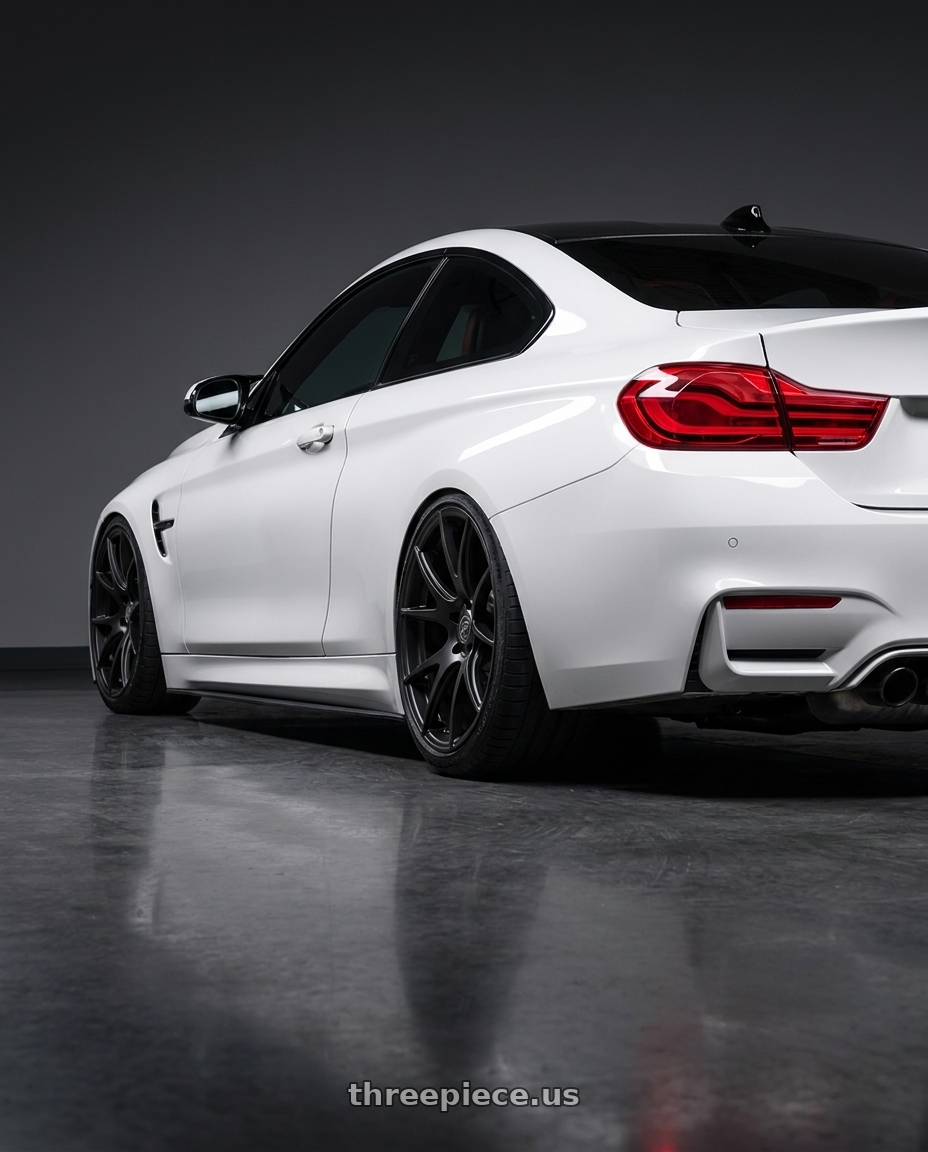 2018 BMW M4 F82 with Forgestar CF5V 5x120 19x9 +38 Satin Black wheels rear three quarter view slight stretch tires