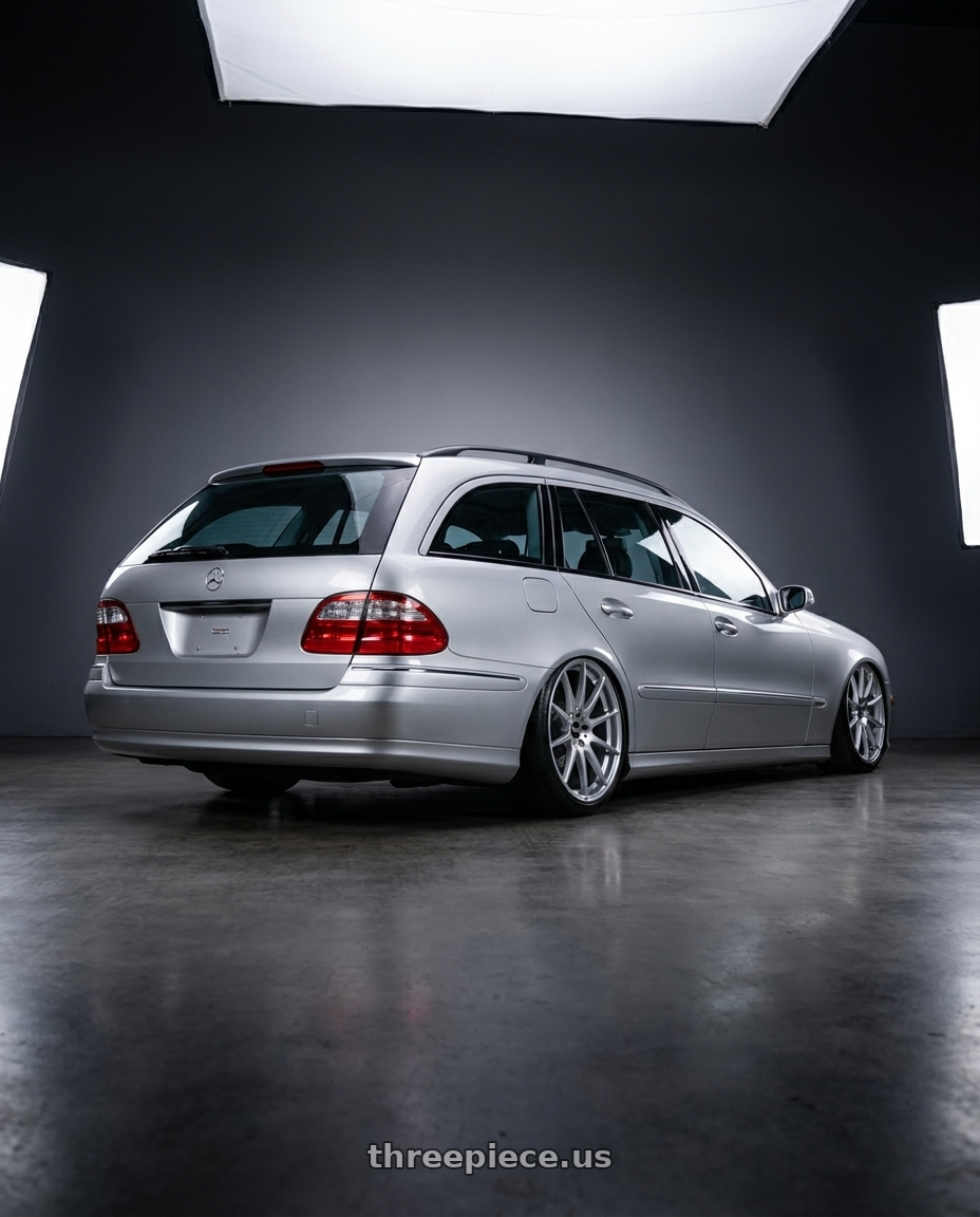 2004 S211 e320 with BBS FS 5x112 19x10 +38 PFS Diamond Silver wheels rear three quarter view slight stretch tires