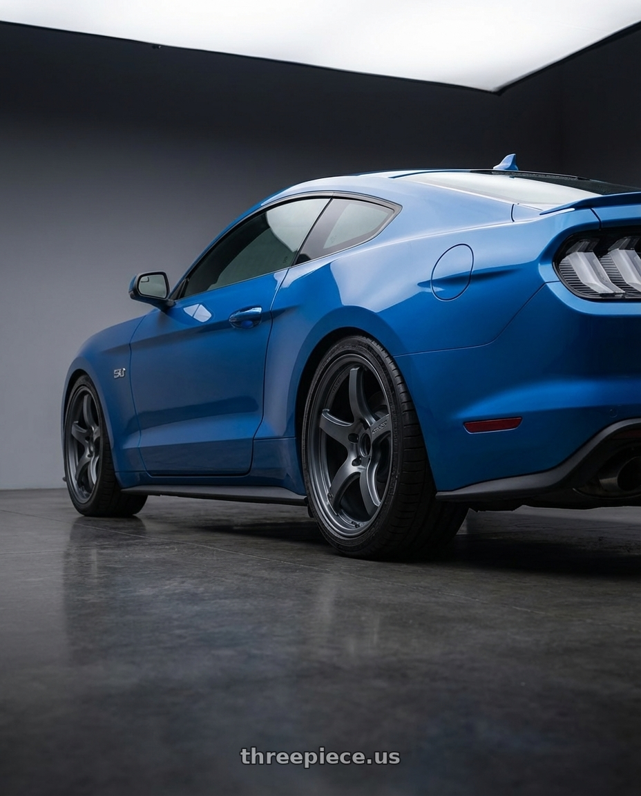 2022 Ford Mustang GT with Gram Lights 57CR 5x114.3 19x8.5+35 Gunblue II wheels rear three quarter view square tires