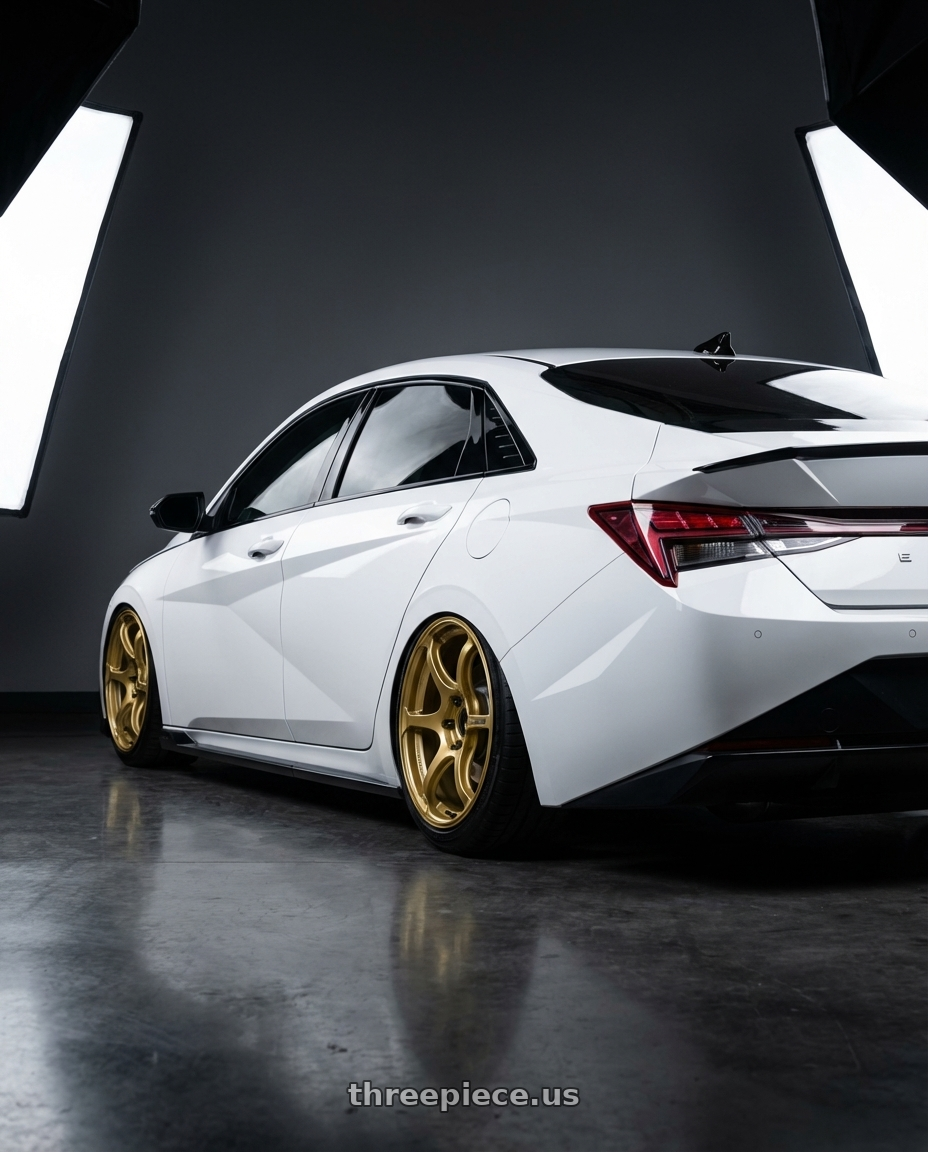2024 Hyundai Elantra N with Advan RGIII 5x114.3 19x10.5+15 Gold wheels rear three quarter view slight stretch tires