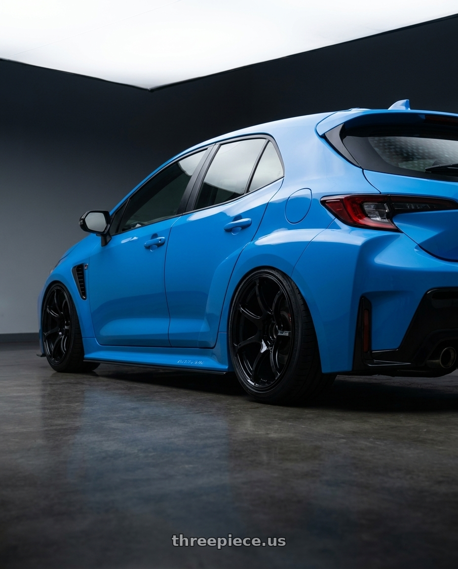 2024 Toyota GR Corolla with Advan RGIII 5x114.3 18x8.5+51 Gloss Black wheels rear three quarter view slight stretch tires