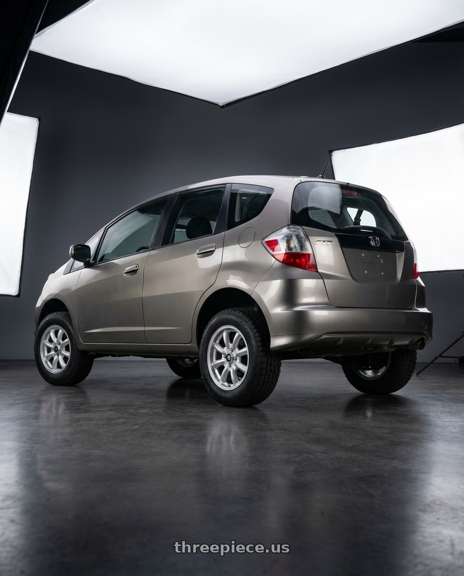 2013 Honda fit with Enkei Compe 4x100 16x7+38 Silver wheels rear three quarter view meaty tires