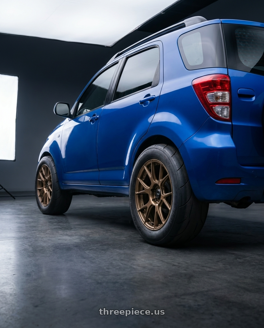 2009 daihatsu terios with Konig Ampliform 5x114.3 19x9.5+35 Gloss Bronze wheels rear three quarter view excessive tires