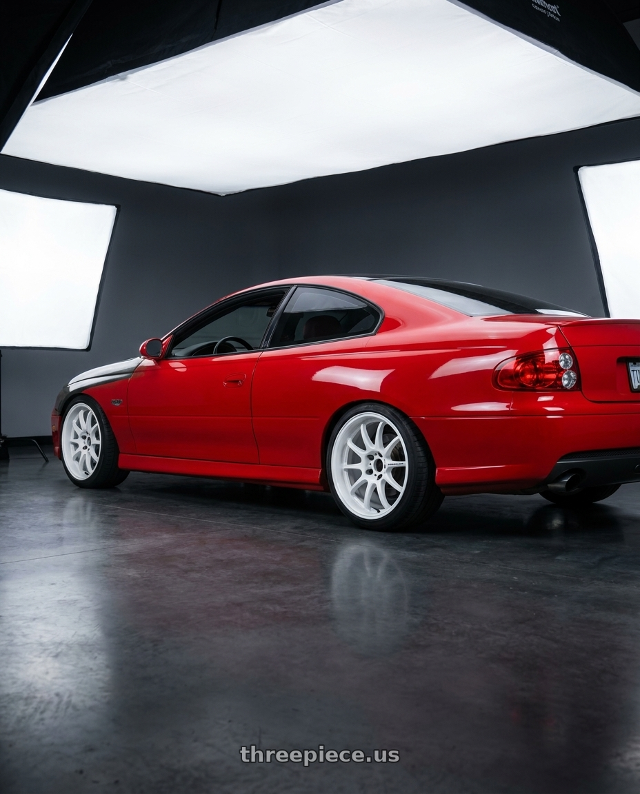 2004 Pontiac gto with Work Emotion D9r 5x120 18x8.5 +38 White wheels rear three quarter view slight stretch tires