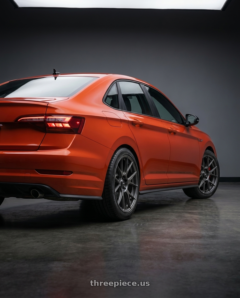 2023 Volkswagen Jetta GLI MK7 with Konig Ampliform 5x112 18x8.5+43 Dark Metallic Graphite wheels rear three quarter view square tires